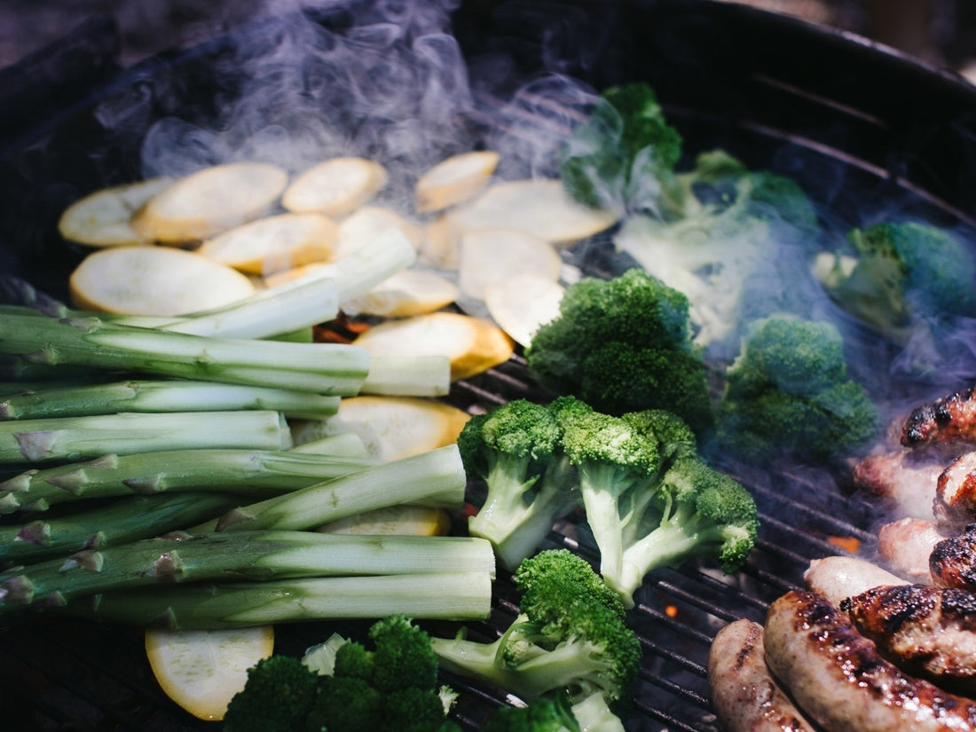 Healthy And Clean Grilled Foods On The BBQ Organic Asparagus Broccoli Yellow Summer Squash And Bratwurst