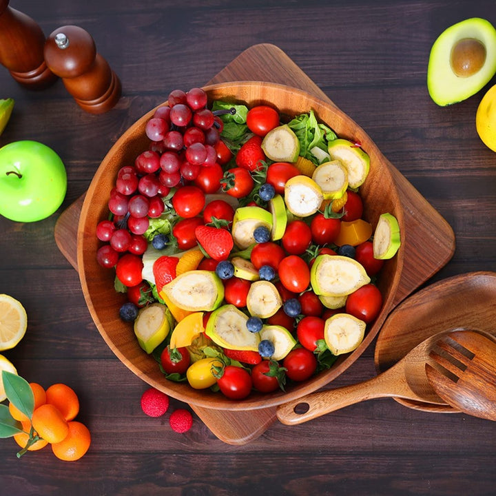 Fresh Berry And Fruit Salad In Acacia Wood Bowl With Acacia Serving Utensils