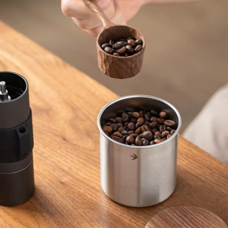 Home Barista Making Coffee Using Stainless Steel Canister