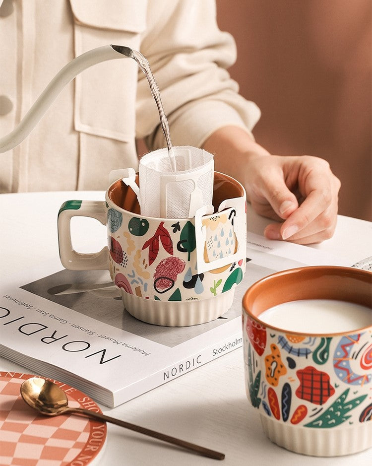 Making Tea Pouring Water Into Artful Abstracts Mug With Colorful Pattern And Bold Print