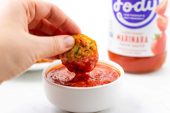 Dipping Supreme Pizza Quinoa Bites Into Non-GMO Marinara Sauce From Fody