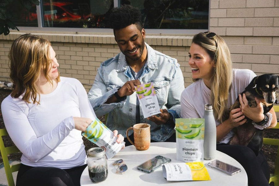 Happy People Eating Healthy Snacks Outdoors Amazi Plantain Chips