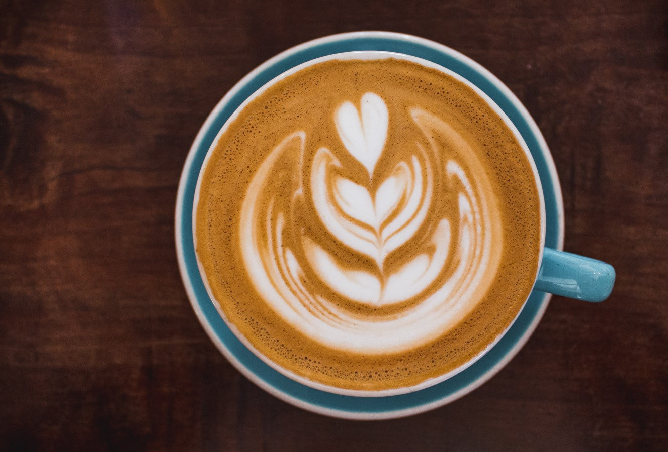 Pretty Cappuccino Latte Art In Blue Cup And Saucer