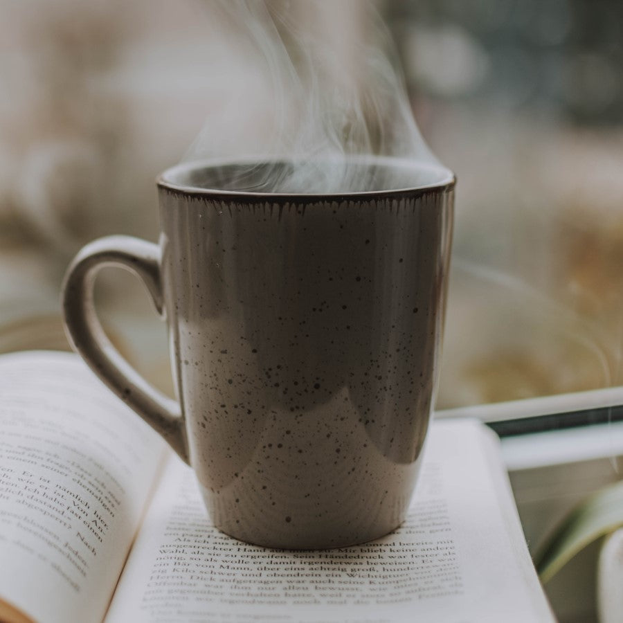 Steaming Mug Of Hot Decaf Coffee From Terra Powders And A Good Book